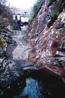 River gorge filled with concrete, looking up toward the hydro electric dam at Loch Garry exit 